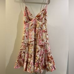 Nwt This Is Perfect For Summer With Its Flowy Floral Print! Size Us Medium 100% Rayon Has A Tie In The Back And A Zipper Closure Never Worn Pink Tiered Sundress In Feminine Style, Pink Tiered Sundress Feminine Style, Pink Tiered Feminine Sundress, Pink Tiered Mini Dress For Garden Party, Feminine Pink Tiered Sundress, Pink A-line Sundress For Garden Party, Pink A-line Mini Dress For Brunch, Pink Tiered Mini Dress For Brunch, Pink Tiered Midi Dress With Floral Print