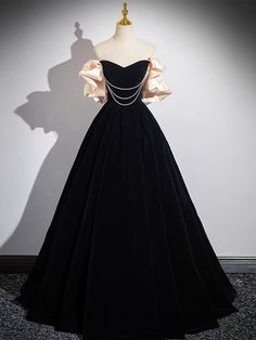 Black A-line Gown For Formal Occasions, Black Floor-length Dress For Banquet, Black Gown With Fitted Bodice, Black Fitted A-line Gown, Fitted Black A-line Gown, Black Long Sleeve Dress With Fitted Bodice, Black A-line Gown For Formal Events, Black Dress With Fitted Bodice For Evening, Black Ball Gown Evening Dress