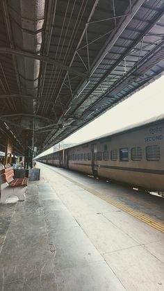 the train is parked at the station waiting for passengers