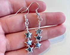 Silver Star Dangles Stainless Steel Earrings Hypoallergenic - Etsy Silver Earrings With Star Charm For Everyday, Silver Star Charm Earrings For Everyday, Minimalist Nickel-free Star Jewelry, Silver Dainty Earrings With Star Charm, Minimalist Nickel-free Star-shaped Jewelry, Minimalist Star-shaped Nickel-free Jewelry, Minimalist Nickel-free Star Shaped Jewelry, Dangly Star Earrings, Silver Stainless Steel Earrings With Star Charm