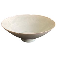 a white bowl sitting on top of a table