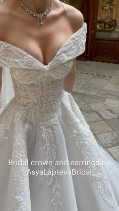 a woman in a wedding dress is posing for the camera