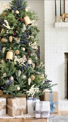 a decorated christmas tree with presents under it