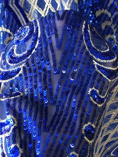 blue and silver beaded dress on display