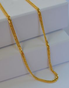 Elevate your everyday style with this exquisite dainty Kihei gold chain necklace, also known as a Japan chain. Crafted with precision, this delicate yet durable piece is perfect for adding a touch of sophistication to any outfit. -Material: 18 k Solid Gold -Necklace Length: 18" -       Chain Width: 2.7 mm PRODUCTION AND SHIPPING PROCESS -Ready to ship in 1-2 days. -Shipping through usps 1-5 days PERFECT GIFT -Your Jewelry comes in a lovely gift box. -If you are gifting this to a loved one, be sure to send us a message. A personal note would add a wonderful touch. Lock Design, Solid Gold Necklace, Everyday Accessories, Gold Chain Necklace, Necklace Length, Everyday Style, Lovely Gift, Gold Chain, Gold Chains