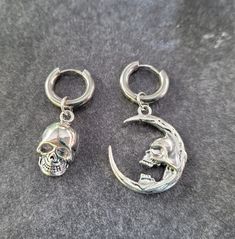 316L Surgical Steel, Hypoallergenic **Choose single earrings or pairs...mix and match options** Great for guys or girls!  Mix and match. Charms are removeable. Sword measures about 3" long. Lightweight and comfortable. Fit normal pierced ears. Click below to see more goth earrings: www.etsy.com/shop/TikiTorchDesigns?ref=seller-platform-mcnav&search_query=goth+earrings **Great gift for yourself or a friend!  Choose the gift message option when you check out if you want me to include a FREE gift b Single Metal Earring For Streetwear, Streetwear Dangle Pierced Earrings, Streetwear Dangle Earrings, Emo Streetwear Jewelry For Halloween, Nickel Free Gothic Jewelry For Streetwear, Gothic Pierced Jewelry For Streetwear, Gothic Nickel Free Jewelry For Streetwear, Punk Dangle Earrings For Streetwear, Punk Style Metal Cartilage Earrings