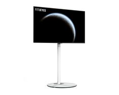 a flat screen tv sitting on top of a white stand next to a black moon