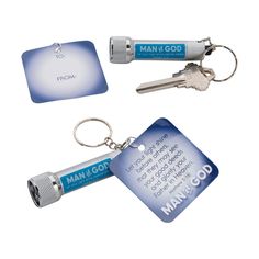 two keychains with keys attached to them, one for man and the other for god