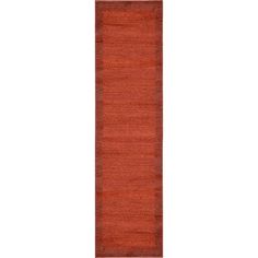 the runner rug is made from red wool and features an orange stripe on the bottom