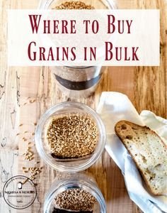 three jars filled with grains and bread on top of a wooden table