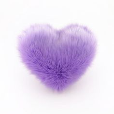 a fluffy purple heart shaped object on a white background