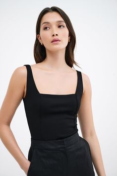 Meet our Anya Top, a cropped, square-neck design from mid-stretch European ponte with princess seams to provide you with a tailored, feminine fit. Complete with soft European mesh lining for maximum comfort and a center back zip for visual interest, Anya is the quintessentially refined basic with a twist. | Yada, in black and in off white, is 5'9" (175 cm) tall, wearing size XS. Shannon, in black and in red, is 5'8 (173 cm) tall, wearing size M. Miqueal, in off white, is 5'10" (178 cm) tall, wea Style Evolution, Personal Color, Princess Seams, Summer Clothing, Princess Seam, Knit Fashion, Sleeveless Tank Top, Black Fits, Sleeveless Tank