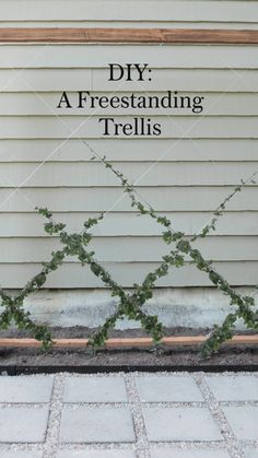 a sign that says diy a freestanding trellis on the side of a house