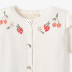 This hand-embroidered cardigan is simply stunning! Elegantly finished with pearl buttons and ribbed trim, it is the perfect layering piece to the garden picnic collection. 100% cotton knit Hand-embroidered details Flutter sleeve detail Mother of pearl buttons Machine wash delicate/gentle, Do not bleach, Tumble dry delicate/gentle, Iron low Summer Cotton Cardigan With Buttons, Playful Cotton Cardigan For Spring, Cute Summer Cotton Cardigan, White Embroidered Cardigan For Spring, Summer Cotton Cardigan With Floral Embroidery, Cute White Cotton Cardigan, Spring Embroidered White Cardigan, Fitted Cotton Cardigan With Floral Embroidery, White Cotton Cardigan With Floral Embroidery