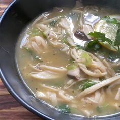 a close up of a bowl of soup on a table