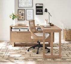 a wooden desk with two drawers and a chair in front of it on top of a rug