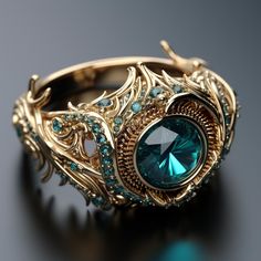 a gold ring with a blue stone surrounded by green and white crystals on a black surface