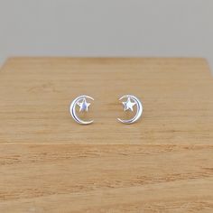 These gorgeous sterling silver crescent moon and star stud earrings are truly special, and will complement any outfit whatever the occasion. The stunning earrings would be a perfect gift for Eid. Your earrings will be placed in one of our lovely Nest embossed gift boxes. Our gift wrap also includes a grey gift bag and a gift tag. If you include a gift message with your order, we will handwrite it onto the gift tag for you. Made from: Sterling silver Dimensions: Approx. 6mm x 5mm Crescent Moon Earrings Studs, Moon Earrings Studs, Crescent Moon And Star, Star Stud Earrings, Crescent Moon Earrings, Star Earrings Stud, Moon And Star, Earrings Studs, Silver Moon