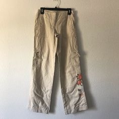 90s Vintage Guess Embroidered Cargo Pants Size 27 In Excellent Condition Bin I Vintage Spring Cargo Pants With Cargo Pockets, Casual Mid-rise Embroidered Pants, Vintage Relaxed Fit Cargo Pants For Spring, Mid-rise Pants With Floral Embroidery For Spring, Spring Mid-rise Pants With Floral Embroidery, 90s Style Wide Leg Cargo Pants For Spring, Embroidered Relaxed Fit Straight Leg Pants, Casual Mid-rise Pants With Floral Embroidery, Embroidered Straight Leg Pants With Relaxed Fit