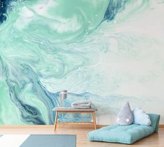 a blue and green wall mural in a living room