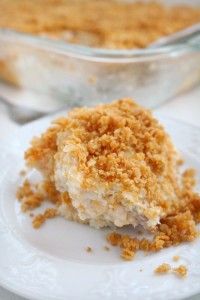 a piece of cake on a plate with some crumbs next to it and another dish in the background