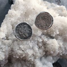 Two floral/palm coins set on surgical steel studs with surgical steel closures. Plated with a rich layer of Rhodium. 10mm diameter. Surgical Steel Earrings, Coin Set, Jewelry Earring, Earring Studs, Coin Jewelry, Jewelry Earrings Studs, Coin, Jewelry Earrings, Plating