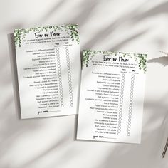 two wedding checklists on top of a table next to a plant with leaves