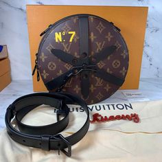 Louis Vuitton Wheelbox bag 💙 Guaranteed Authentic and will be shipped directly to eBay for authentication and and shipping. 💙 New with box, dustbag, tags, and strap. Receipt available upon request. 💙 Rare limited edition 2022 collectible designed by Virgil Abloh. 💙 The distinctive round shape and leather straps of the Wheel Box recall the House’s historic Chauffeur hatbox from 1905, designed especially for limousines. Classic Monogram canvas is accented with a bright yellow “N°7” in honor of Louis Vuitton Box Bag, Round Louis Vuitton Bag, Lv Virgil Abloh, Louis Vuitton Camera Box Bag, Louis Vuitton Croisette, Louis Vuitton Metis, Louis Vuitton Eva, Louis Vuitton Felicie, Louis Vuitton Neonoe