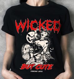 Unleash your wicked side with our 'Wicked But Cute' unisex tee! This vintage goth t-shirt combines edgy style with a touch of charm. You'll feel fierce and adorable at the same time. Who says you can't have it all? . Wicked But Cute Unisex T-shirt. 100% combed ringspun cotton· Light fabric· Premium fit· Runs bigger than usual· Original design Care Instructions: Machine wash cold. Do not bleach. Tumble dry low. Edgy Halloween T-shirt For Alternative Fashion, Distressed Black T-shirt For Alternative Fashion, Black Distressed T-shirt For Alternative Fashion, Edgy Halloween Concert T-shirt, Gothic Distressed Tops For Streetwear, Alternative Distressed Halloween T-shirt, Emo Halloween Concert T-shirt, Gothic Halloween Concert T-shirt, Edgy T-shirt For Halloween