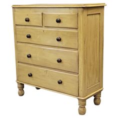 a wooden dresser with four drawers and two knobs