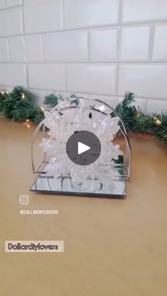 a snow globe sitting on top of a wooden table