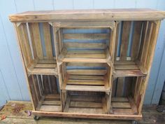 a wooden shelf with several compartments on it