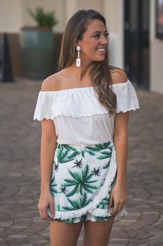 This palm printed skort is perfect for spring and summer vacations! Skirt in the front with fringe white detailing and shorts in the back with ruffles at the bottom! Elastic around the waist for a stretchy fit! Pair with our Lauren Off the Shoulder Top Paige is a size 0-2 and is wearing a small, runs true to size! Summer Vacations, Palm Print, Womens Casual, Off The Shoulder Top, Affordable Clothes, Womens Casual Outfits, Summer Vacation, Shoulder Top, Ruffles