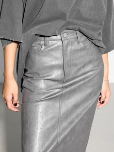 Slim fit pencil vegan leather skirt. Hugging silhouette with button and zipper closure. Midi length. Model is in MINUSEY S. ✔️ Free worldwide express shipping over $100✔️ Loved by 6,500+ customers✔️ Limited edition collections, maximum style⠀⠀⠀⠀⠀⠀⠀⠀⠀Stay ahead of the trend with can’t-find-anywhere-else staples. Your closet will thank you 💕 * MINUSEY S = EU 34, US 2* MINUSEY M = EU 36, US 4* 65% Polyester / 35% Rayon* Dry clean* Made in Korea - Model Height: 172cm/5'7" (US2, EU34) Leather Pencil Skirt For Spring, Trendy Leather Pencil Skirt, Vegan Leather Midi Skirt, Vegan Leather Skirt, Leather Midi Skirt, White Charcoal, Mermaid Skirt, Leather Mini Skirts, The Trend