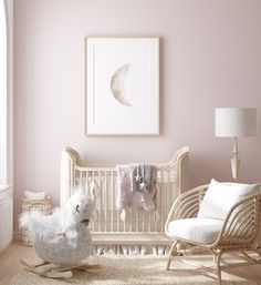 a baby's room with pink walls and white furniture