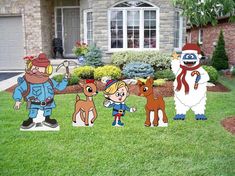 cartoon characters are standing in front of a house with lawn decorations on the lawn and trees behind them