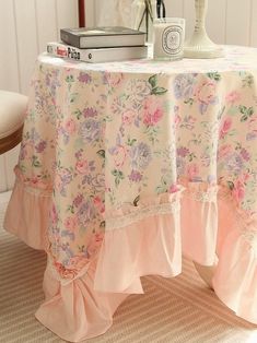 there is a table with a flowered cloth on it