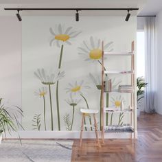 a wall mural with daisies on it