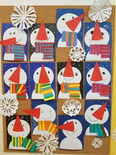 a bulletin board with paper snowmen and hats on it's sides, surrounded by snowflakes