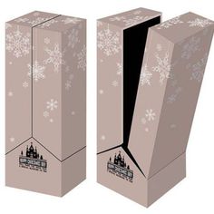 two boxes with snowflakes on them and one has a black opening in the middle