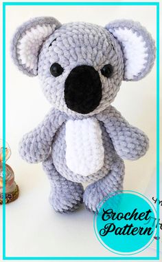 a crocheted koala bear sitting on top of a table