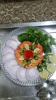 a platter filled with lots of food on top of a metal tray