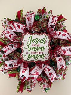 a christmas wreath that says jesus is the reason for the season