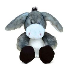 a gray and white stuffed animal with black feet