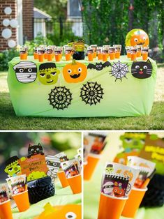 an orange and green table topped with lots of halloween decorations on top of a lush green field