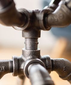 the pipes are connected to each other on the table and in front of the camera