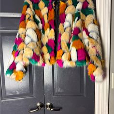 Add A Pop Of Color To Your Winter Wardrobe With This Eloquii Faux Fur Jacket. The Multicolored Design Is Perfect For Those Who Love To Stand Out, While The Polyester Insulation Material Will Keep You Warm On Chilly Days. The Jacket Features A Faux Fur Outer Shell And Lining Material, Making It A Great Addition To Any Plus-Sized Woman's Closet. With A Size Of 18/20, This Jacket Is Perfect For Women Who Want To Make A Statement While Staying Comfortable. This Colorful Jacket Is Perfect For Any Occ Fitted Multicolor Winter Outerwear, Trendy Multicolor Outerwear For Fall, Trendy Multicolor Fall Outerwear, Trendy Multicolor Spring Outerwear, Pink Faux Fur Trim Coat For Spring, Multicolor Winter Outerwear With Faux Fur Trim, Multicolor Outerwear With Faux Fur Trim For Winter, Chic Multicolor Long Sleeve Outerwear, Multicolor Faux Fur Trim Outerwear For Fall