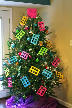 a brightly colored christmas tree decorated with legos