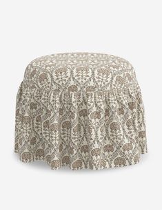 a brown and white patterned ottoman cover