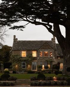 a large house that is lit up at night